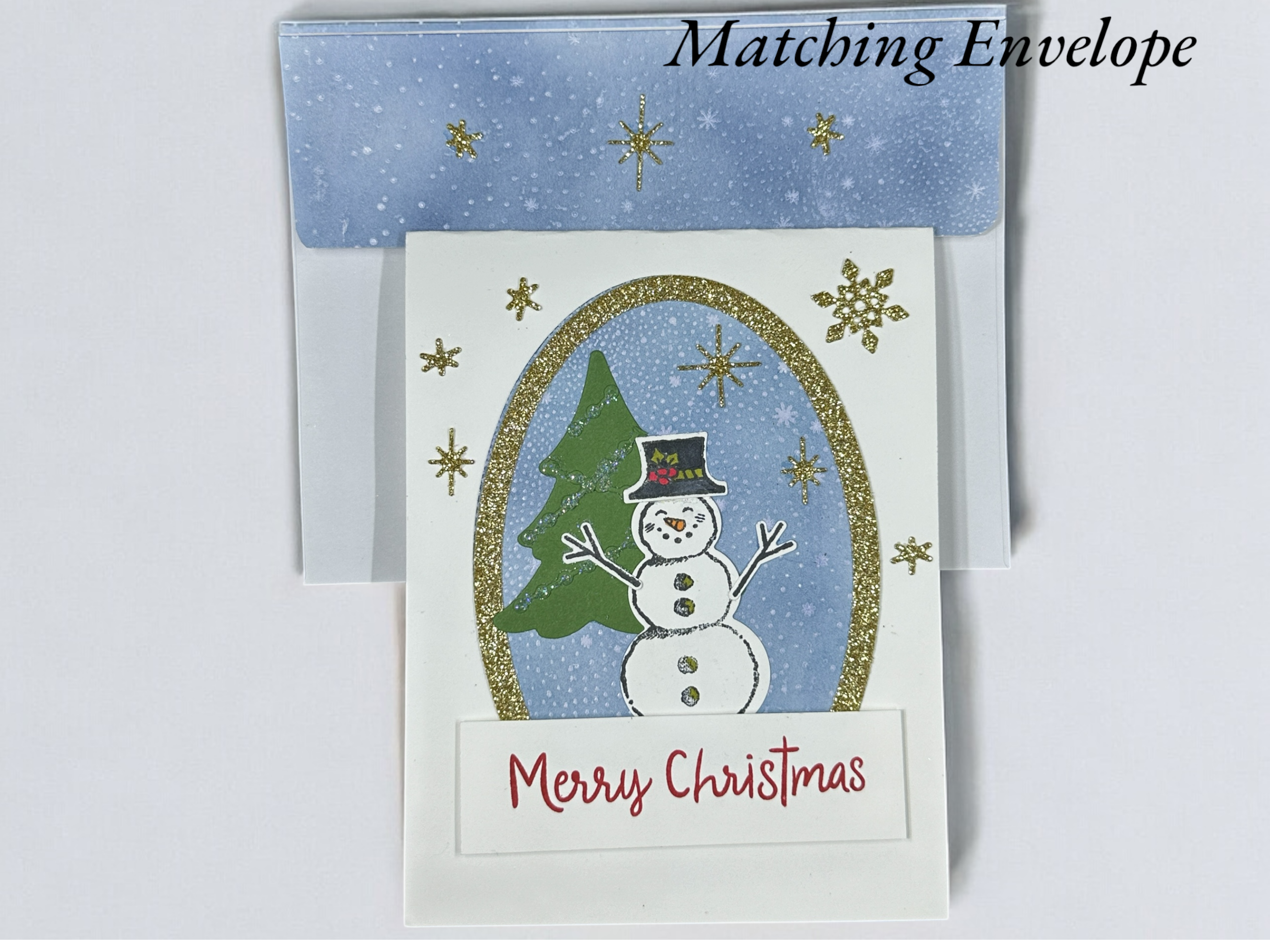 Snowman Christmas Card with Glittery Gold Snowflakes and Festive Design