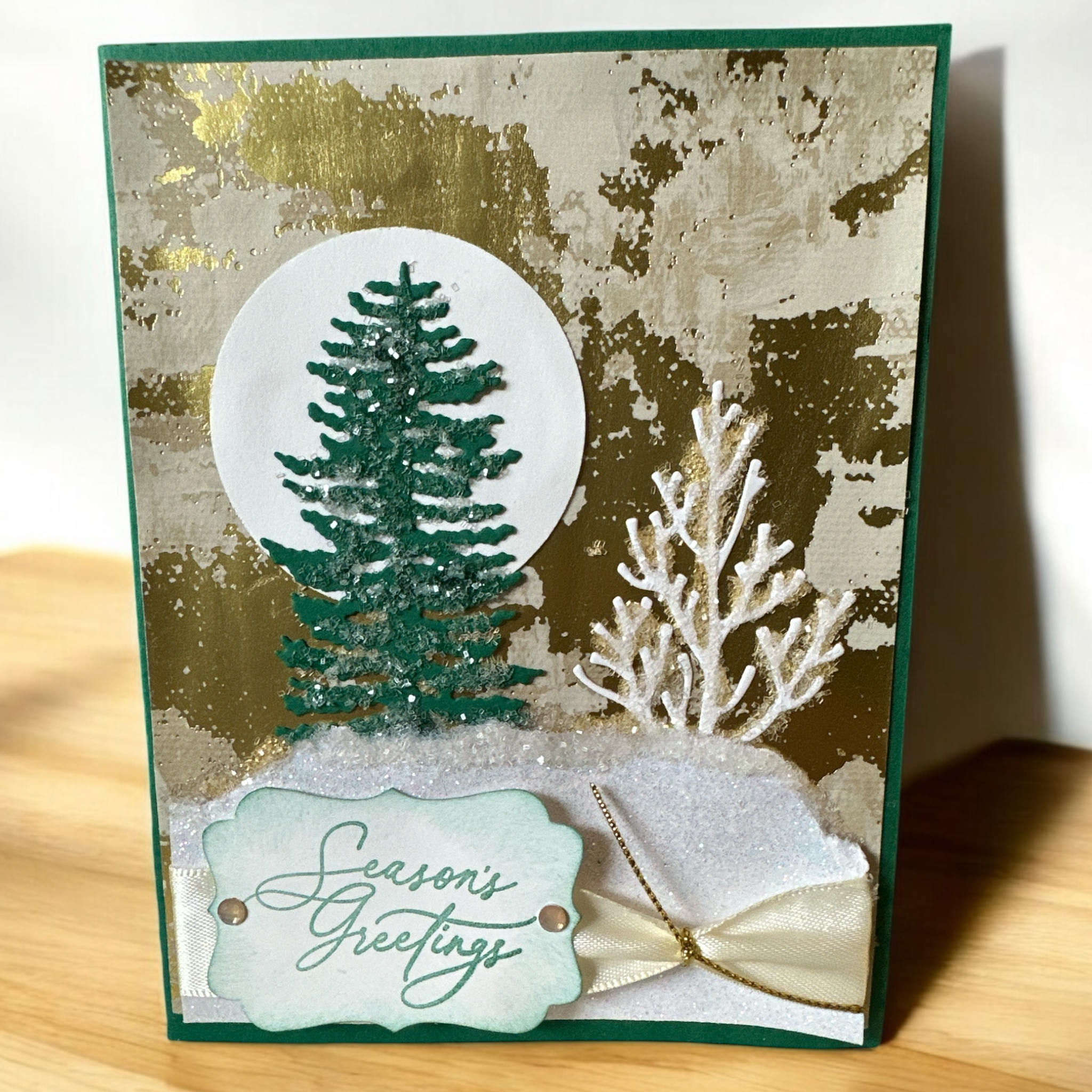 Elegant Christmas Card with Gold Foil Background and Glittery Snow Hills