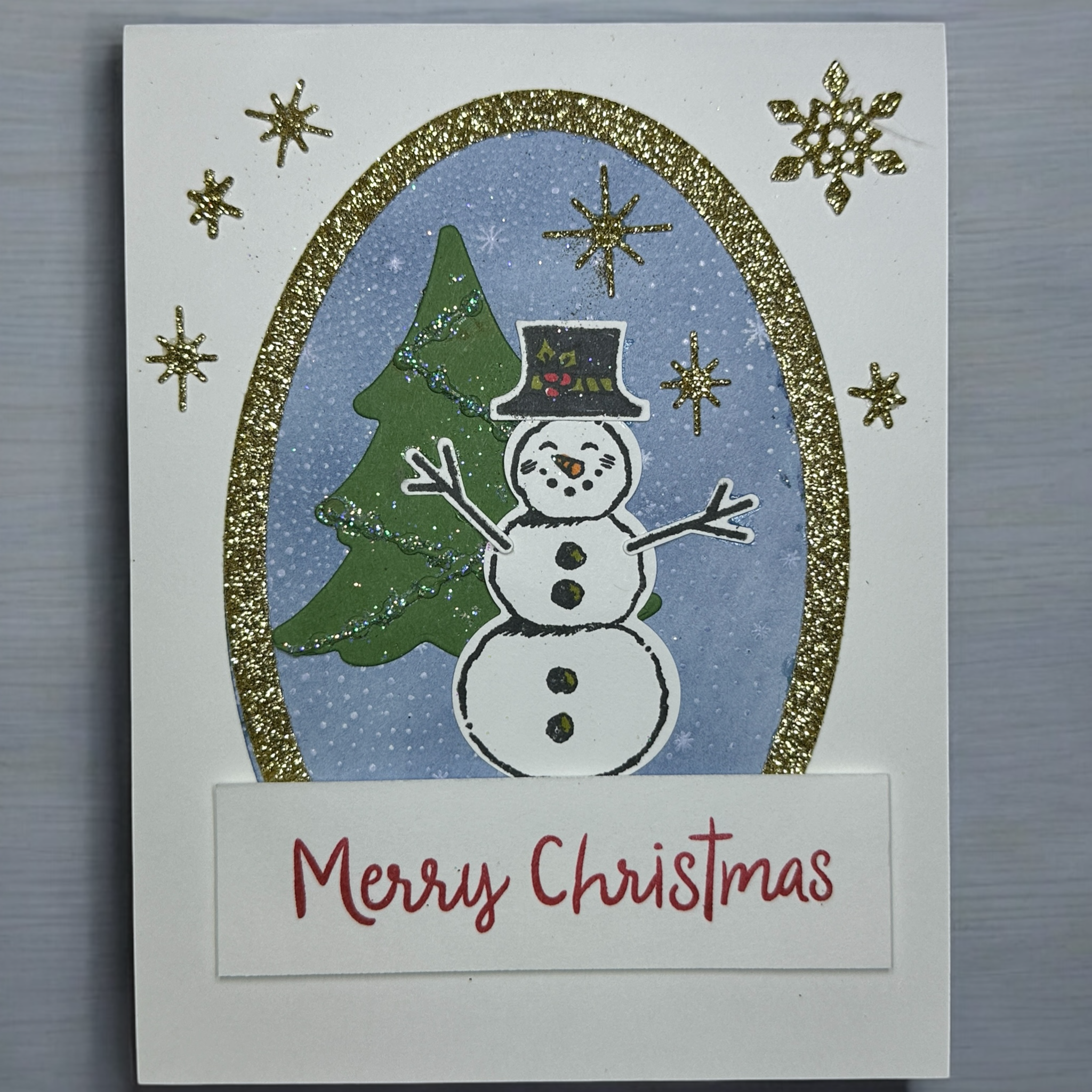 Snowman Christmas Card with Glittery Gold Snowflakes and Festive Design