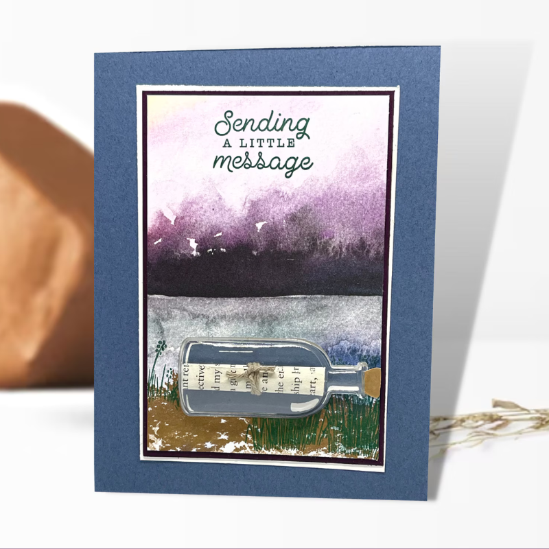 Sending a little message in card that has a 3D message in a bottle. Mountain and lake background