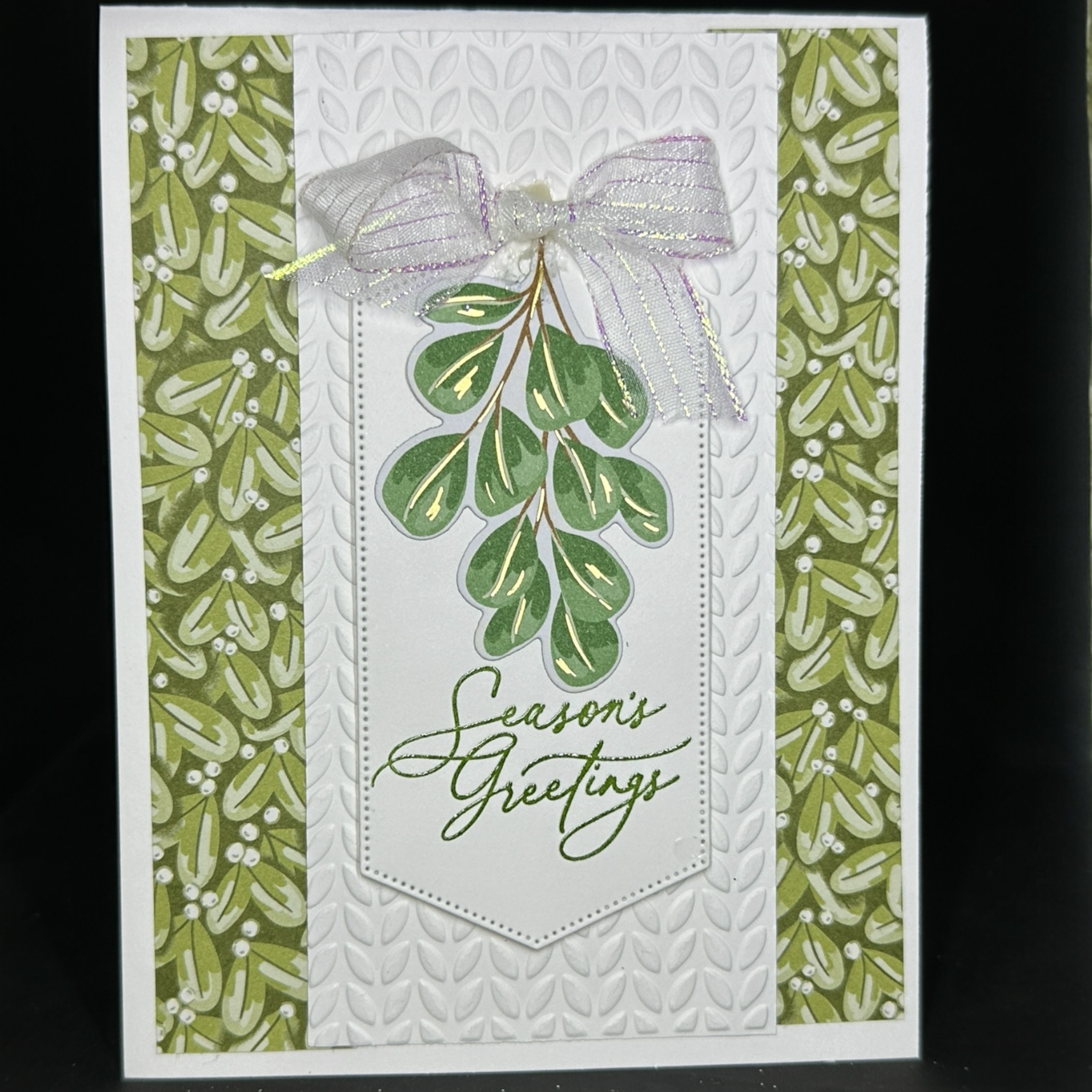 Elegant Christmas Card with Botanical Design and Leaf Embossed Accents