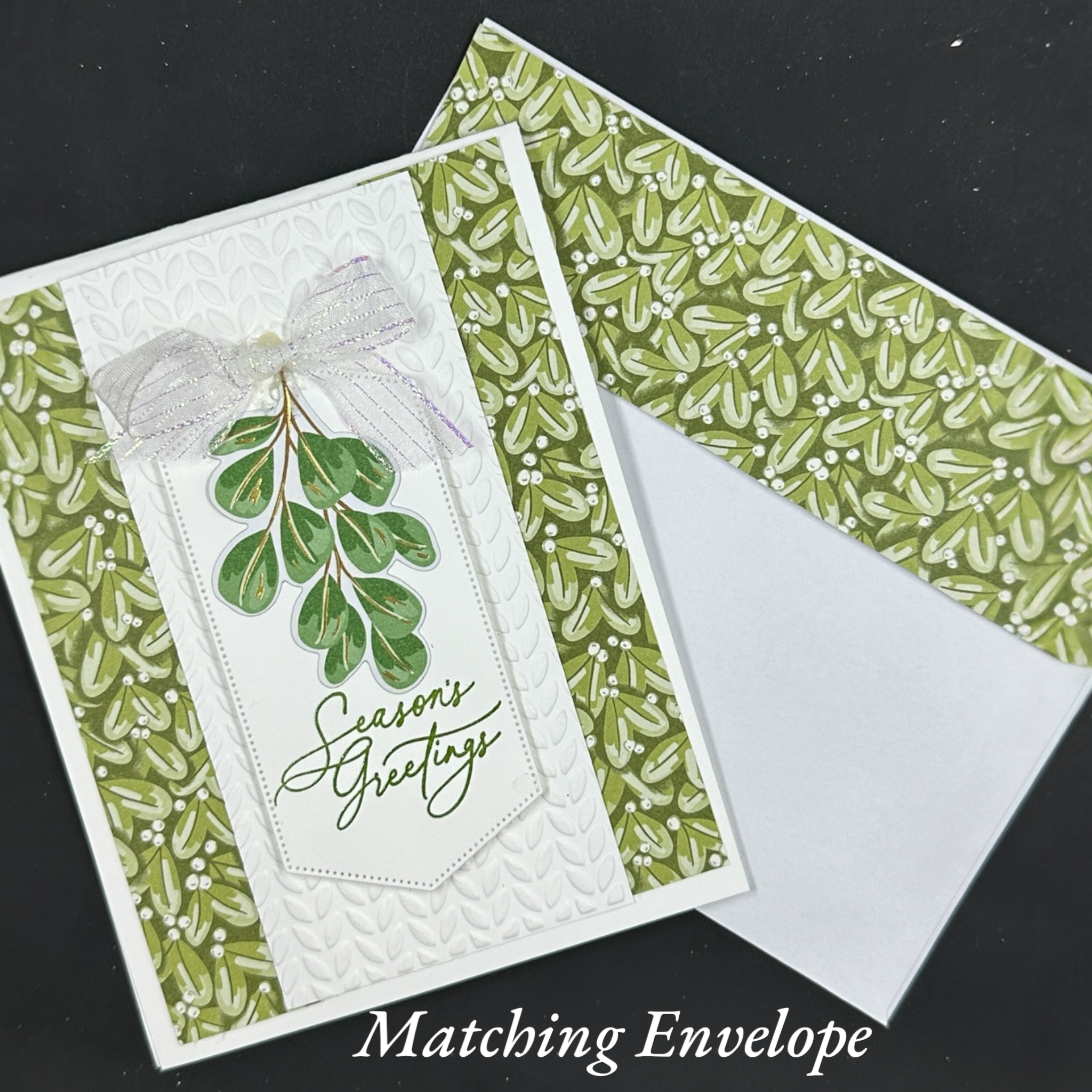 Elegant Christmas Card with Botanical Design and Leaf Embossed Accents