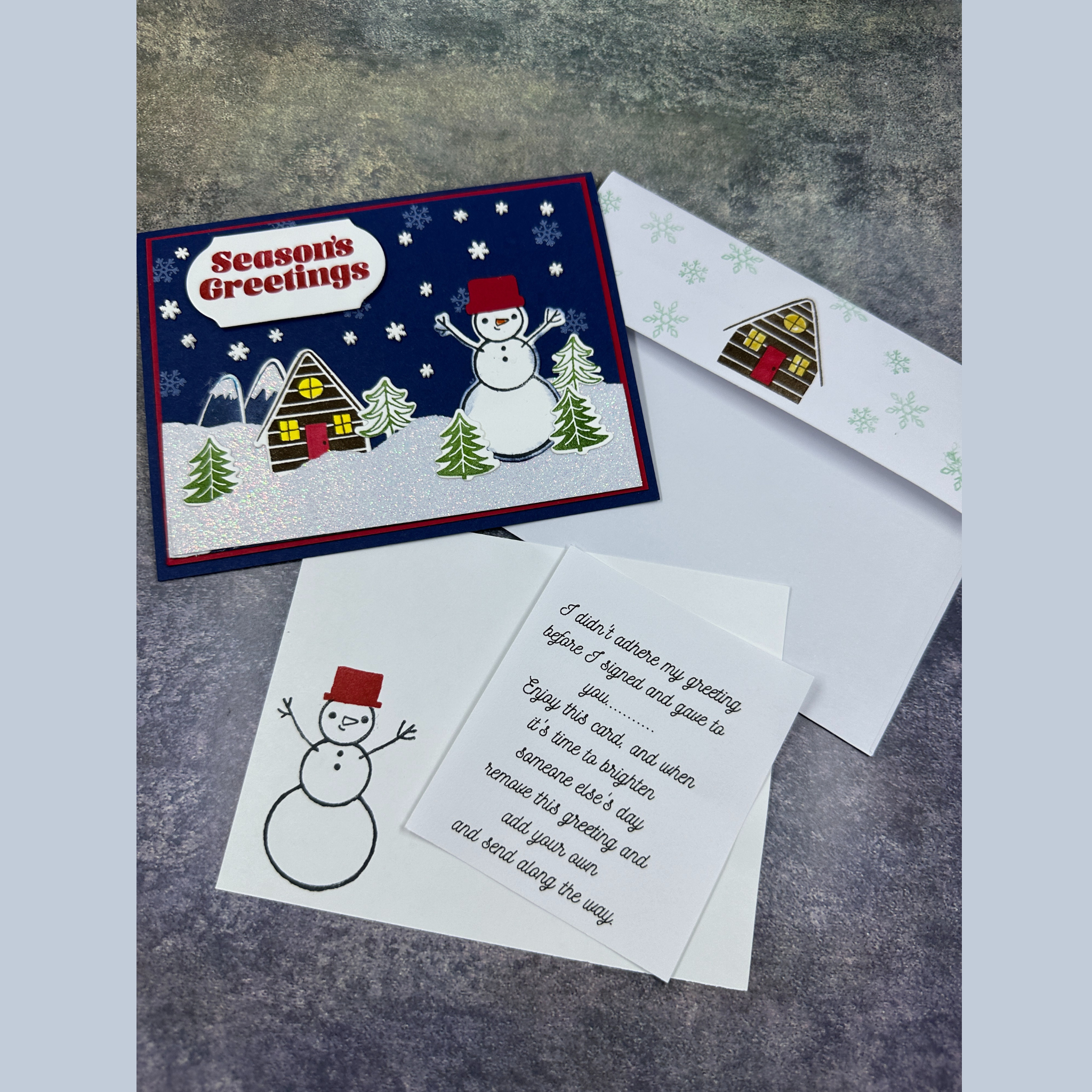 Sparkling Snowman Holiday Card with Cozy Home and Snowflake Accents